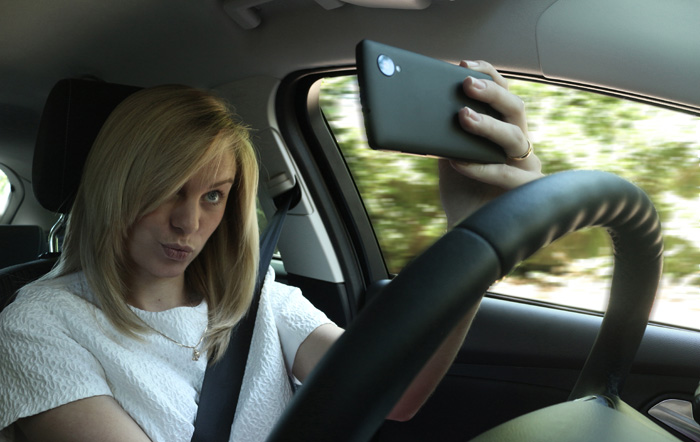 Woman selfie and driving